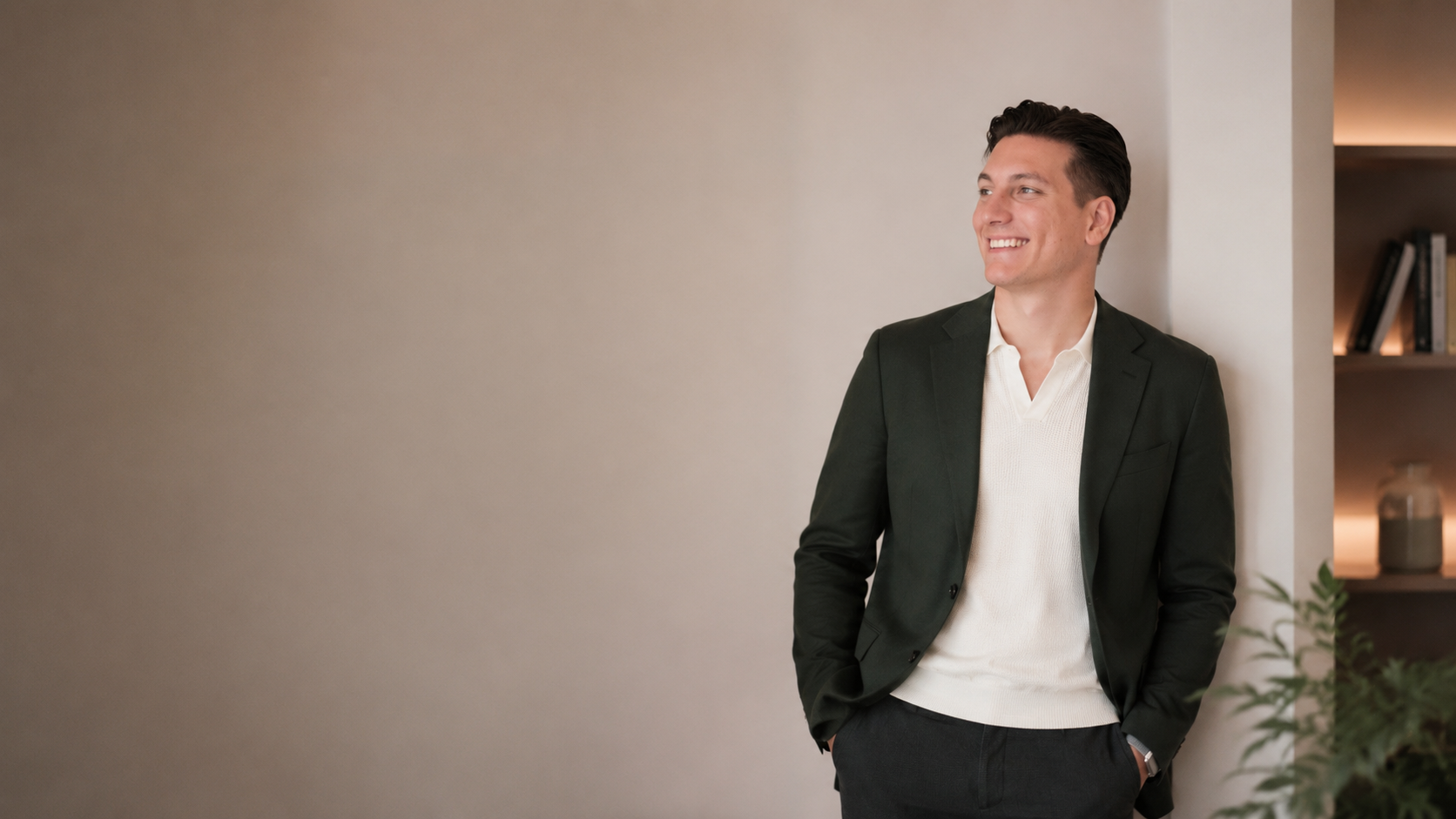 Reuel Lento standing in a tailored jacket